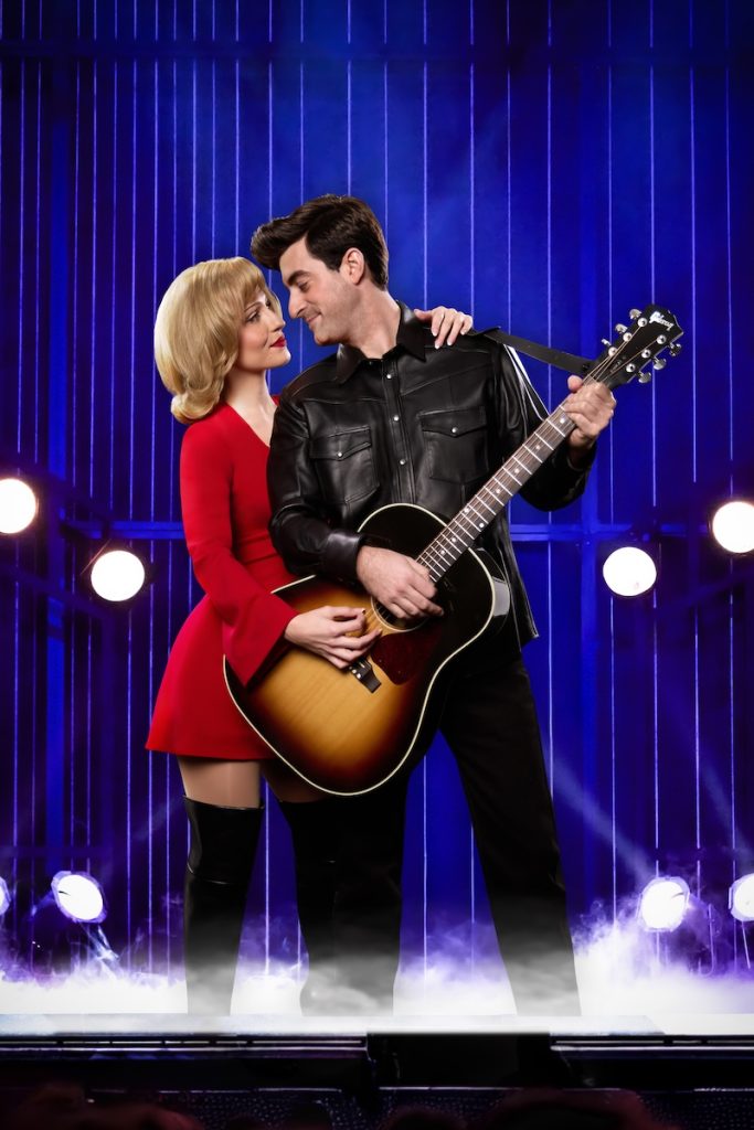 Ryahn Evers as Marcia Murphey and Max Braunstein as Neil Then share an intimate moment, holding a guitar.